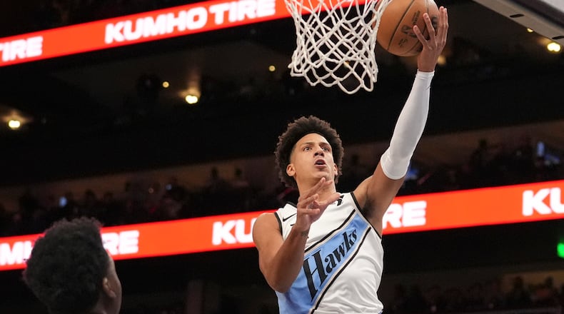 Atlanta Hawks forward Jalen Johnson (1) shoots and scores in the first half of an NBA basketball game against the Los Angeles Lakers, Friday, Dec. 6, 2024, in Atlanta. (AP Photo/Brynn Anderson)