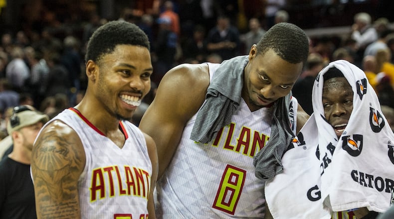 Atlanta Hawks’ Kent Bazemore (24), Dwight Howard (8), and Dennis Schroder, right, fool around after defeating the Cleveland Cavaliers in an NBA basketball game in Cleveland, Tuesday, Nov. 8, 2016. (AP Photo/Phil Long)