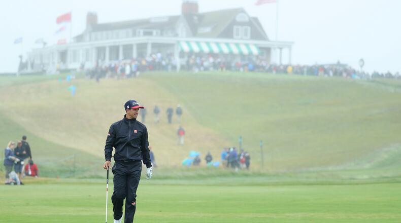Adam Scott is part of the scenery on a damp afternoon at Shinnecock Hills. (Photo by Warren Little/Getty Images)