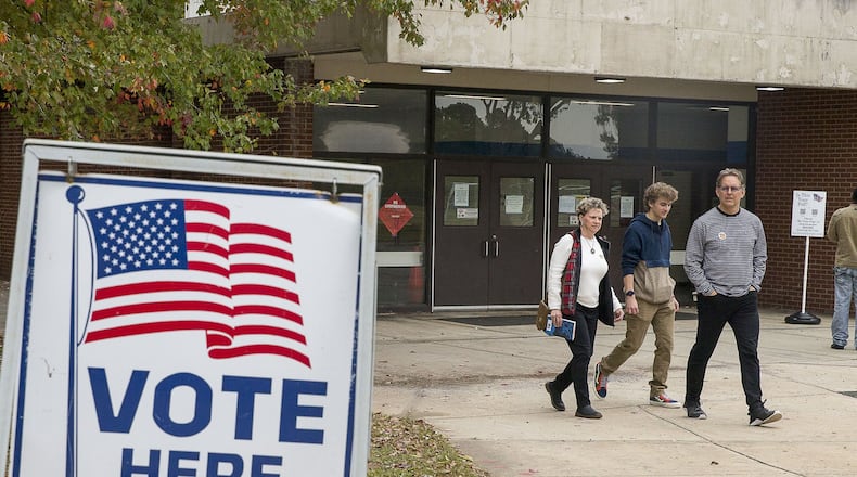 Jeff Brown (right), his wife Melony Brown (left) and their son Palmer Brown, leave Campbell Middle School after Jeff and Melony casted their ballots during Election Day in Smyrna, Tuesday, November 5, 2019. Both Jeff and Melony were able to cast their votes while Palmer, 18, who recently missed the registration date, was unable. Palmer plans on registering and voting in the upcoming 2020 elections. ALYSSA POINTER / APOINTER@AJC.COM