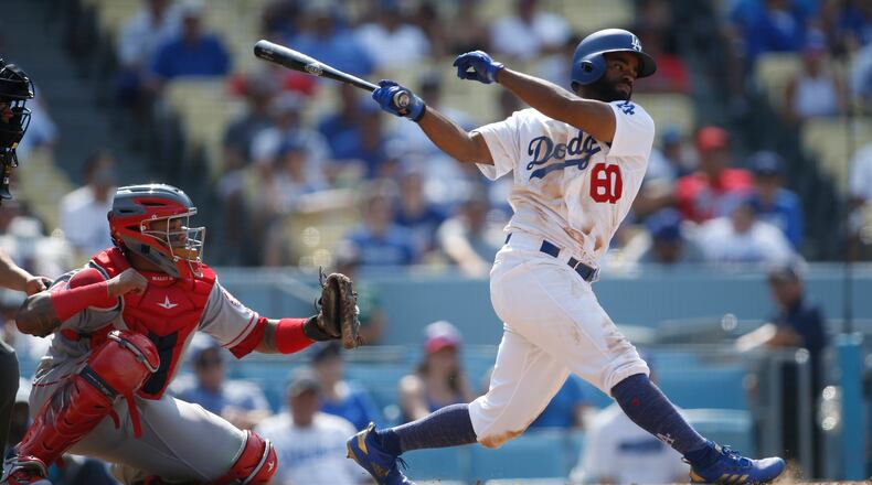 The Los Angeles Dodgers' Andrew Toles hits an RBI single in 2018. (AP Photo/Danny Moloshok)