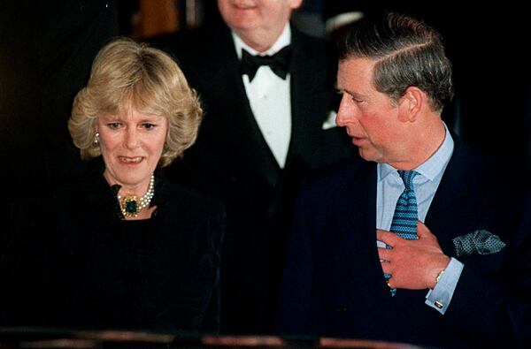 FILE - Britain's Prince Charles and Camilla Parker Bowles leave the Ritz Hotel in London, the first time that the couple, who have been friends for more than 25 years, have appeared together in public, Thursday, Jan. 28, 1999. (AP Photo/Alastair Grant, File)
