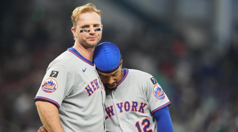 FILE - New York Mets' Pete Alonso, left, stands with Francisco Lindor after flying out with the bases loaded during the fifth inning of a baseball game against the Miami Marlins, Sunday, Sept. 28, 2025, in Miami. (AP Photo/Lynne Sladky, File)