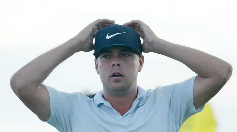What did I just do? Keith Mitchell reacts after making a birdie putt on the 18th green to win the Honda Classic in early March. (Photo by Michael Reaves/Getty Images)