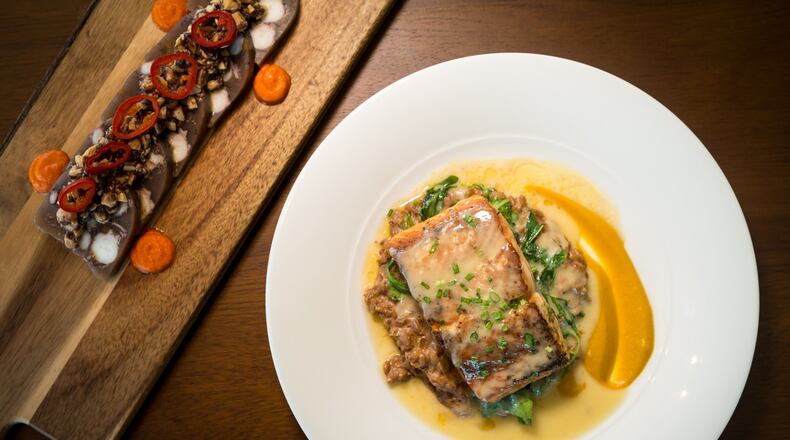 Steelhead Trout with lemon artichoke 'farroto' ricotta and olives, cumin roasted carrot mousseline, and champagne Beurre Blanc, with Octopus Terrine starter (left). Photo credit- Mia Yakel.