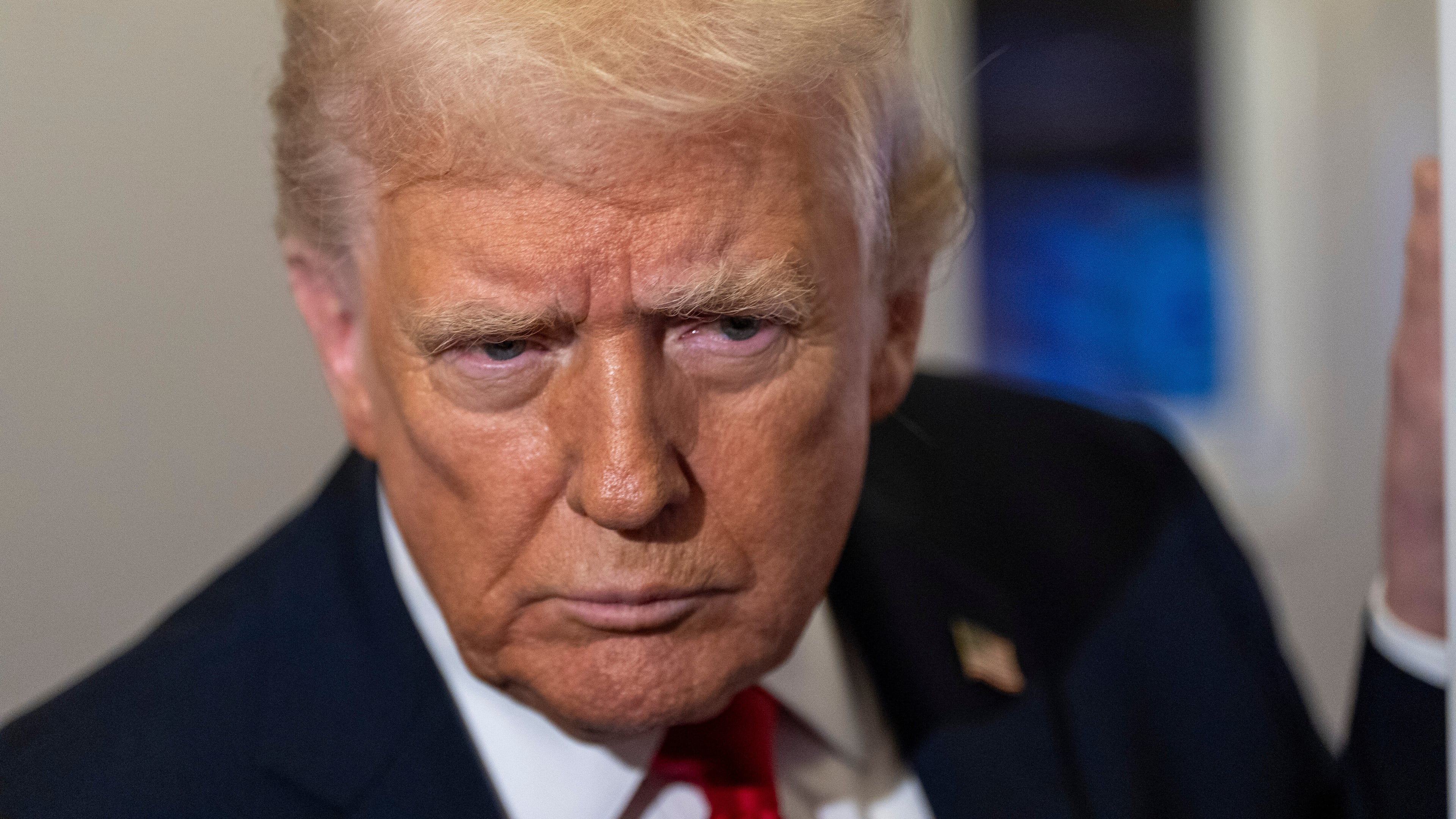 President Donald Trump leans in to hear a question as he speaks with reporters while in flight on Air Force One from Joint Base Andrews to his Mar-a-Lago estate in Palm Beach, Fla., Tuesday, Nov. 25, 2025. (AP Photo/Alex Brandon)
