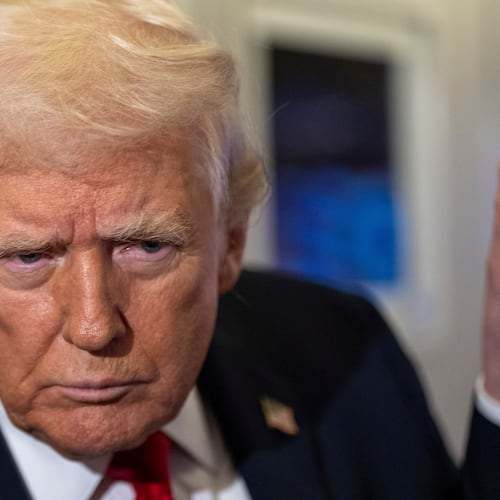 President Donald Trump leans in to hear a question as he speaks with reporters while in flight on Air Force One from Joint Base Andrews to his Mar-a-Lago estate in Palm Beach, Fla., Tuesday, Nov. 25, 2025. (AP Photo/Alex Brandon)