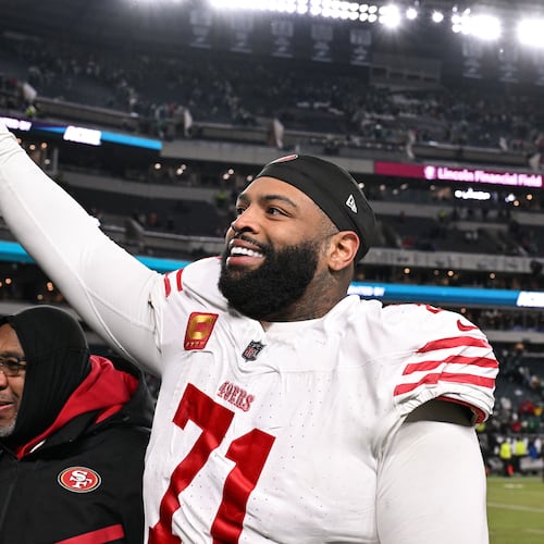 FILE - San Francisco 49ers offensive tackle Trent Williams (71) celebrates as he walks off the field after an NFL wild card playoff football game against the Philadelphia Eagles, Jan. 11, 2026, in Philadelphia. (AP Photo/Terrance Williams, File)