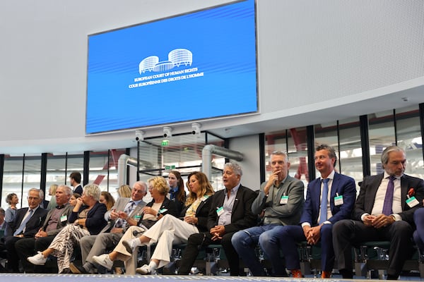 Plaintiffs sit in the European Court of Human Rights before it issues a landmark set of rulings about alleged Russian violations in Ukraine since 2014, including the downing of Malaysia Airlines flight MH17, Wednesday, July 9, 2025 in Strasbourg, eastern France. (AP Photo/Antonin Utz)
