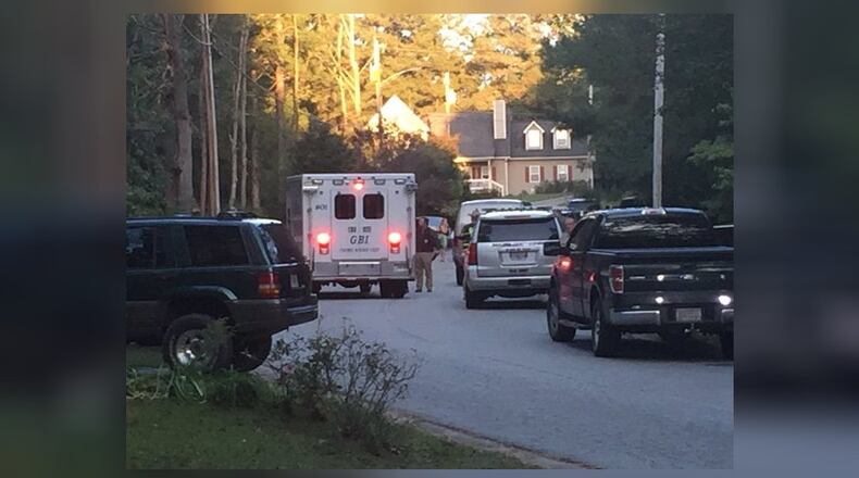 A suspect was shot and killed by a Paulding County deputy while authorities were serving a warrant.