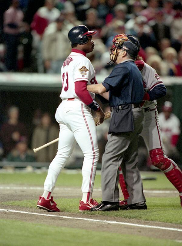 Cleveland's Eddie Murray (left) is restrained by the umpire and Braves catcher Charlie O'Brien (right) after burshback pitch from Atlanta's Greg Maddux in Game 5 of the 1995 World Series, Oct. 26, 1995, in Cleveland. (Frank Neimeir/AJC)