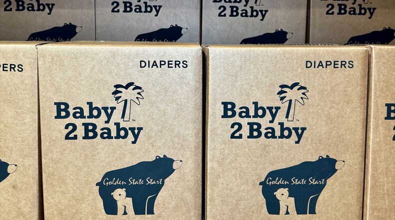 This photo provided by Baby2Baby shows stacks of packaged diapers Wednesday, May 7, 2026, at Baby2Baby's Los Angeles headquarters. (Baby2Baby via AP)