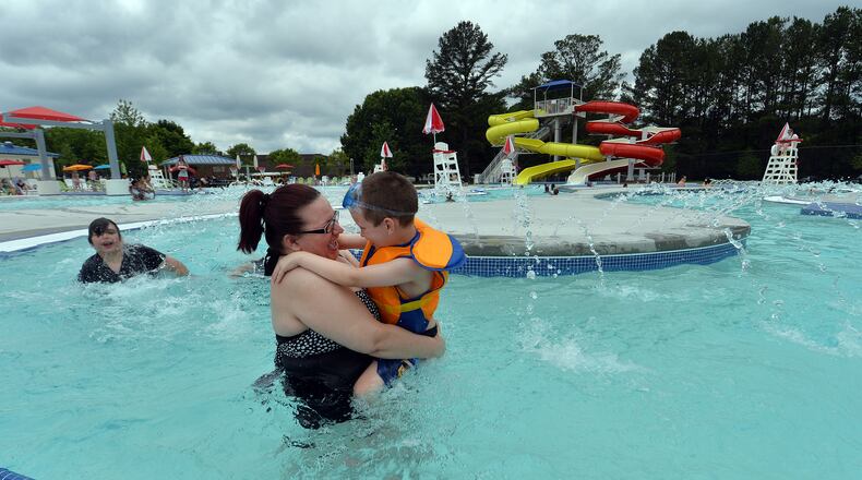 Deanna Thrasher and her son, Landon, 5, enjoy floating down the Lazy River in the Seven Springs Water Park in Powder Springs in summer 2015. KENT D. JOHNSON /KDJOHNSON@AJC.COM