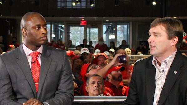Georgia head coach Kirby Smart talks with D.J. Shockley on National Signing Day at Butts-Mehre Heritage Hall in Athens. (Emily Selby for the AJC 2016)