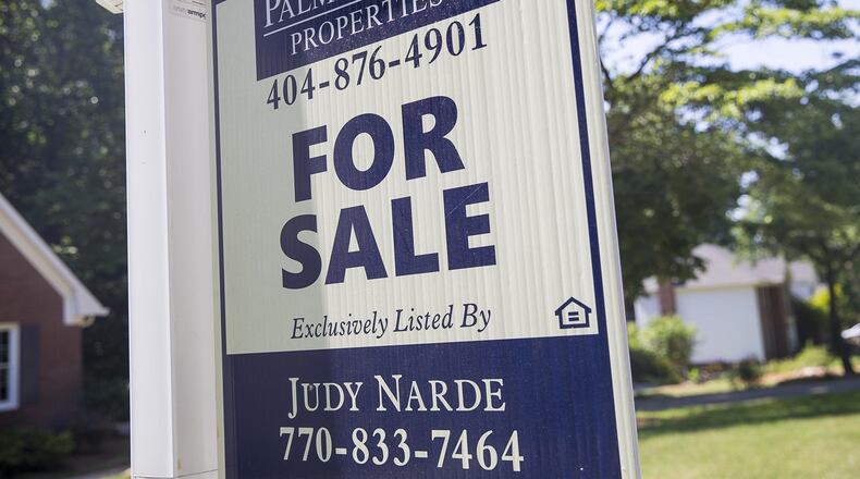A for sale sign in Lilburn on Tuesday. Metro Atlanta remains one of the stronger home sale markets in the nation, according to a report issued Tuesday. (Alyssa Pointer/alyssa.pointer@ajc.com)
