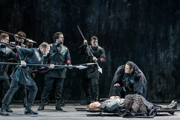 Le Bu as Gunther leans over the stretchered Siegfried, sung by Stefan Vink. (Raftermen/Courtesy of Atlanta Opera)