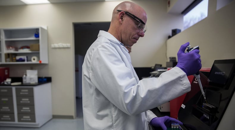 Ancera Software Engineer Gary Root prepares to run an assay on their platform. Ancera is a startup in Branford that has created a machine that can detect and count bacteria in food. This machine will first be sold and used in poultry slaughterhouses for quicker testing of bacterias like salmonella, listeria and other contaminants. (Lauren Schneiderman/Hartford Courant/TNS)