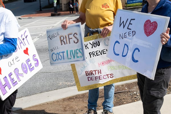 People protest outside of the Centers for Disease Control and Prevention in Atlanta on Tuesday, April 1, 2025 after layoffs were announced. (AP Photo/Ben Gray)