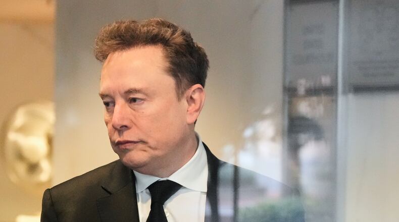 Elon Musk arrives at the U.S. District Court in Oakland, Calif., Tuesday, April 28, 2026. (AP Photo/Godofredo A. Vásquez)