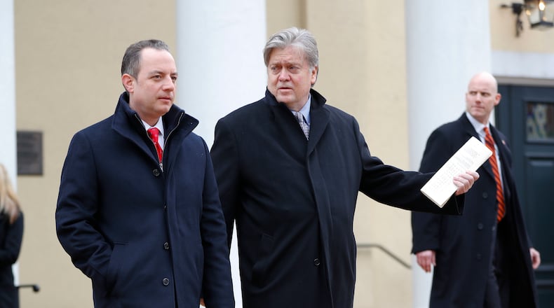 Incoming White House Chief of Staff Reince Priebus, left, and Chief strategist for President-elect Donald Trump, Steve Bannon, right, walk out after attending church service at St. John's Episcopal Church across from the White House in Washington, Friday, Jan. 20, 2017. (AP Photo/Pablo Martinez Monsivais)