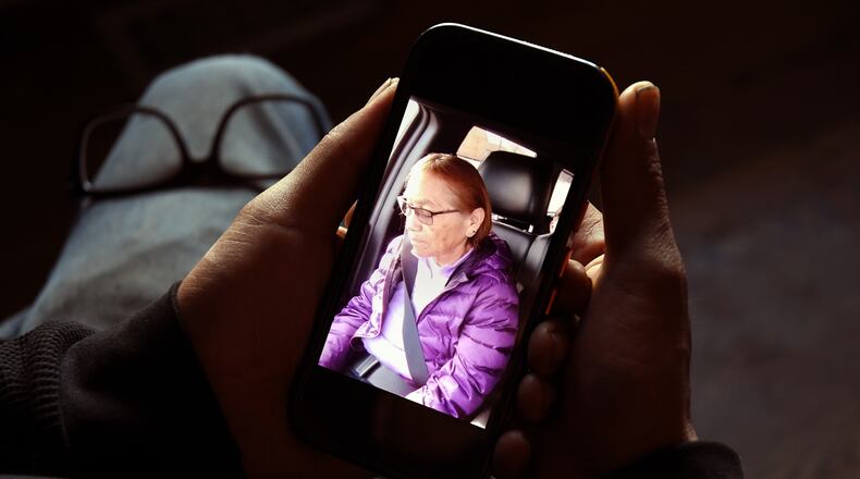 FILE - Gerald Begay, whose mother Ella Mae Begay went missing from her home, shows a photo of her on his phone in Denver, Thursday, April 2, 2026. (AP Photo/Thomas Peipert,File)