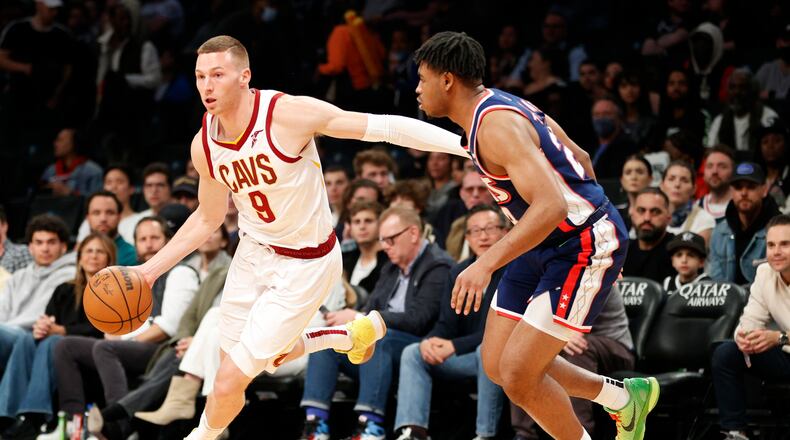 Dylan Windler (9) of the Cleveland Cavaliers dribbles as Cam Thomas (24) of the Brooklyn Nets defends during the second half at Barclays Center in New York City, on April 8, 2022.  (Sarah Stier/Getty Images/TNS)