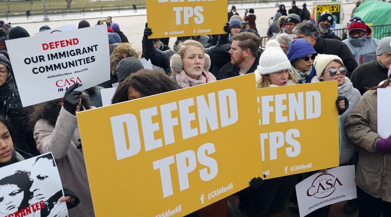 Opponents of the government’s decision to cancel “temporary protective status” for more than 200,000 El Salvadorans in the U.S. demonstrate across from the White House on Monday. (AP Photo/Pablo Martinez Monsivais)