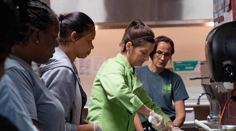 Kimberly Della Donna of Georgia Organics led a workshop on how to cut kale and watermelon at Marietta High School.
