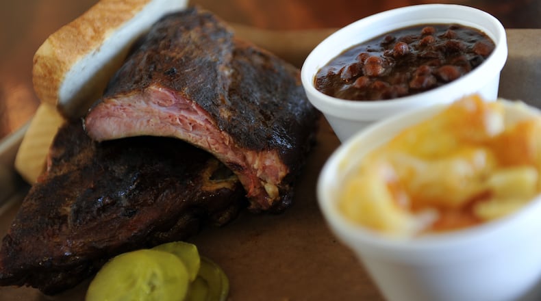 Pork baby back ribs plate, a slice of Texas toast, mac and cheese and baked beans from Grand Champion BBQ.