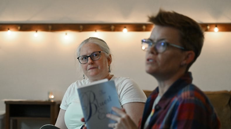 Candace Rowell (right), organizer, and Jessica Perlove discuss "The Bluest Eye" by Toni Morrison this month with other participants, who have joined online, at a banned book club meeting at Virginia-Highland Church, Thursday, September 19, 2024, in Atlanta. (Hyosub Shin / AJC)