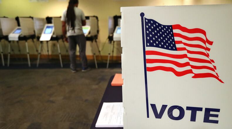 A early voter casts his ballot at the Buckhead Library on Thursday, November 2, 2017, in Atlanta. Curtis Compton/ccompton@ajc.com