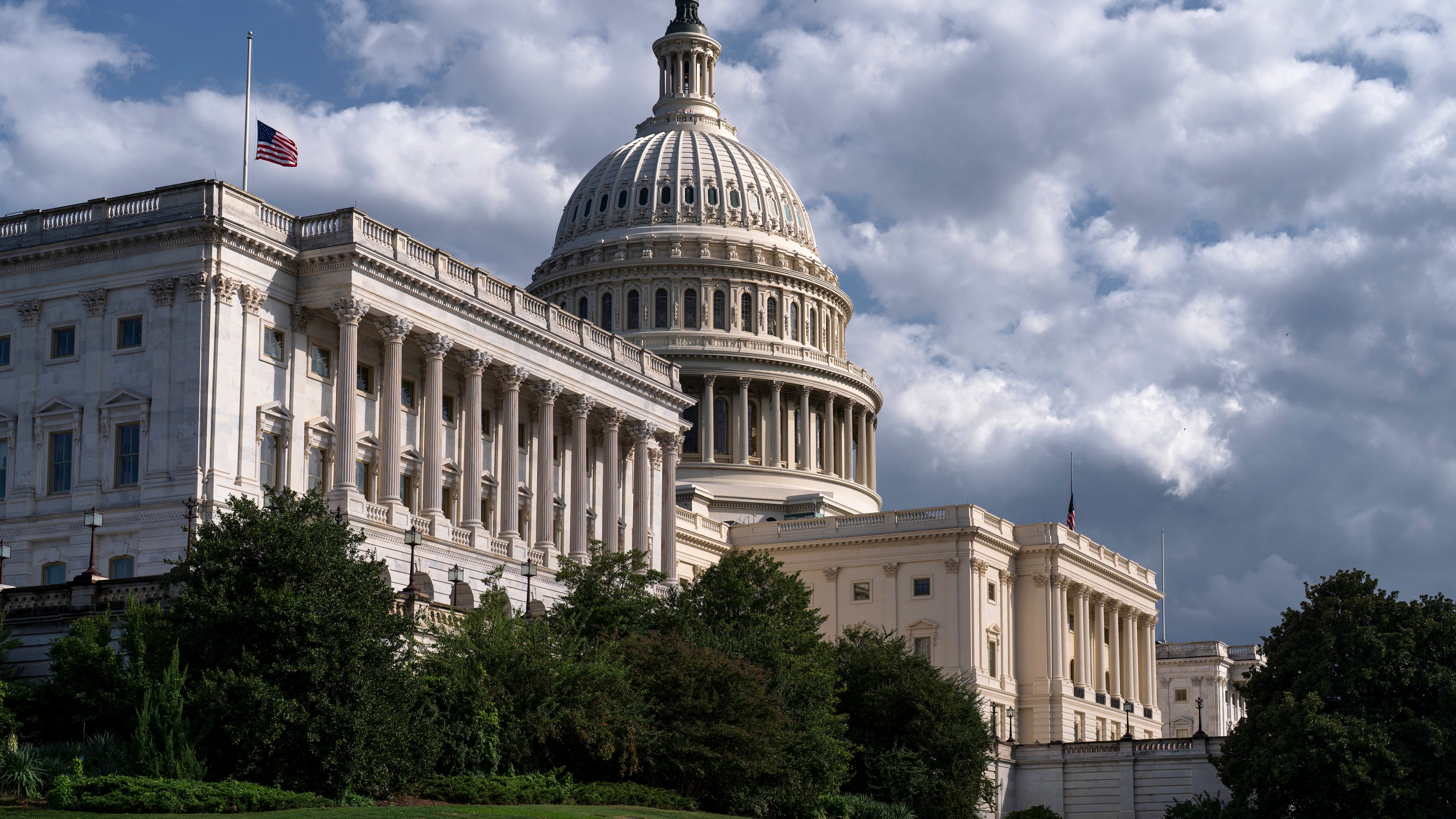 The west front of the Capitol is seen in Washington, Thursday, Sept. 11, 2025, where the flags have been lowered to half-staff after the assassination of conservative activist Charlie Kirk. (AP Photo/J. Scott Applewhite)