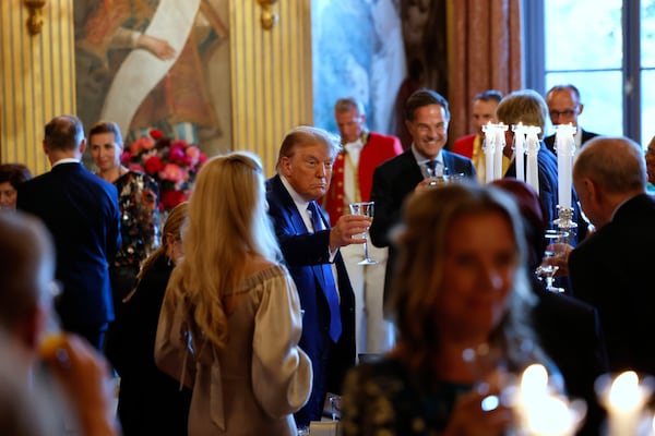 President Donald Trump, center, attends a dinner of NATO heads of state and government at the Paleis Huis ten Bosch ahead of the NATO summit in The Hague, Netherlands, Tuesday, June 24, 2025. (Remko de Waal, Pool Photo via AP)