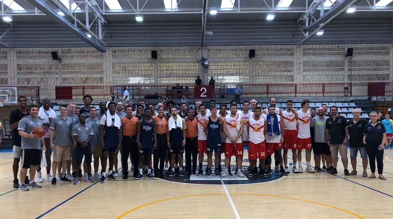 The Georgia Tech basketball team and staff with the team of Spanish professionals after one of their exhibition games in Barcelona. Former Tech captain Quinton Stephens, who is playing professionally in Spain, is behind coach Josh Pastner on the left. (Photo courtesy Mike Stamus, Georgia Tech)