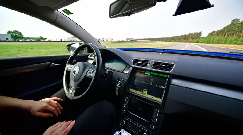 FILE PHOTO: A driver presents a Cruising Chauffeur, a hands free self-driving system designed for motorways during a media event . (Photo by Alexander Koerner/Getty Images)