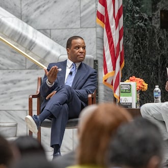 Operation HOPE CEO John Hope Bryant (left) and Atlanta Mayor Andre Dickens discuss the “American Aspiration Tour” in July. Bryant has joined with CIM Group to “address the immense need for affordable housing … .” (Jenni Girtman for the AJC)