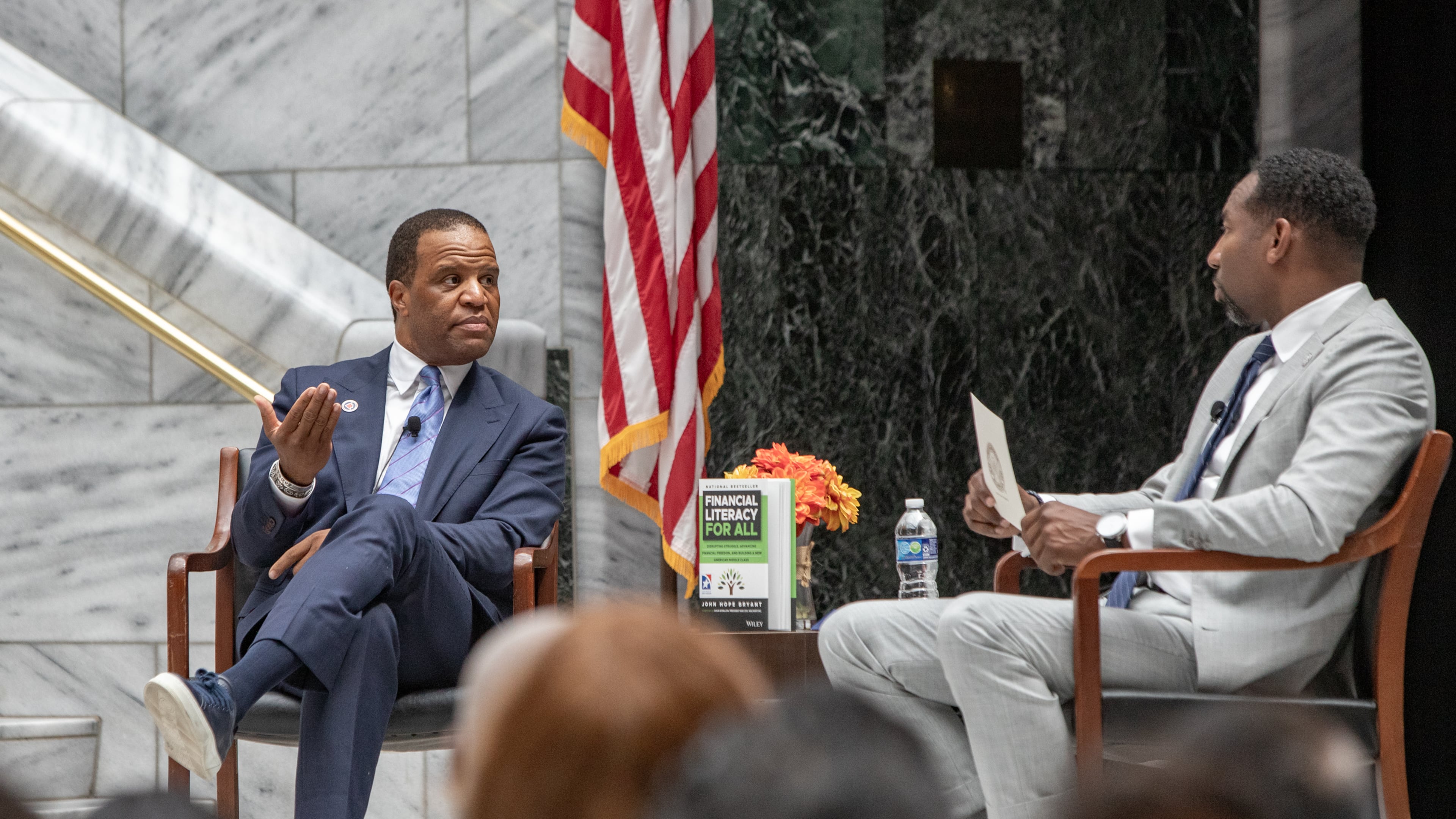 Operation HOPE CEO John Hope Bryant (left) and Atlanta Mayor Andre Dickens discuss the “American Aspiration Tour” in July. Bryant has joined with CIM Group to “address the immense need for affordable housing … .” (Jenni Girtman for the AJC)
