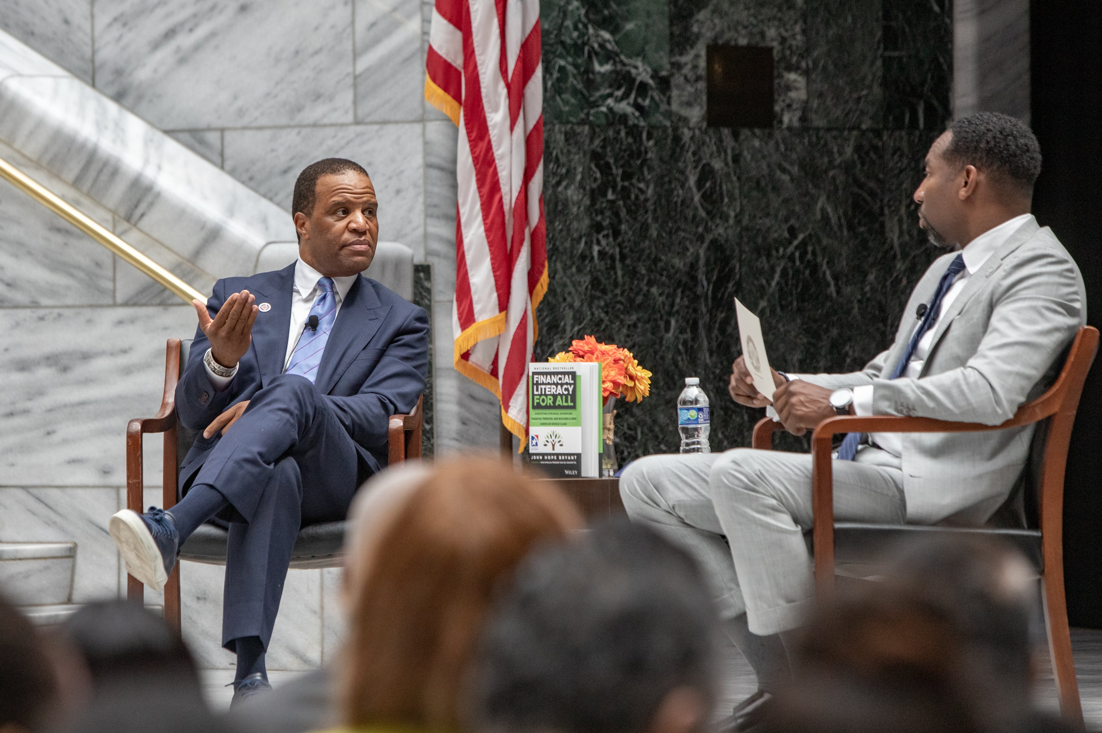 Operation HOPE CEO John Hope Bryant (left) and Atlanta Mayor Andre Dickens discuss the “American Aspiration Tour” in July. Bryant has joined with CIM Group to “address the immense need for affordable housing … .” (Jenni Girtman for the AJC)