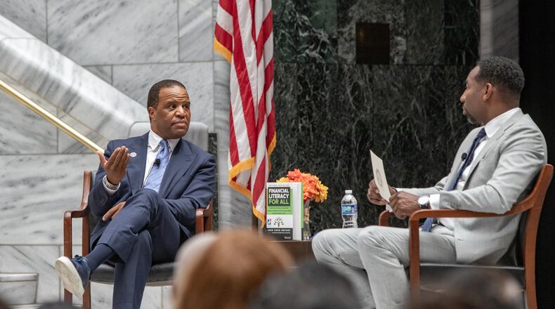 Operation HOPE CEO John Hope Bryant (left) and Atlanta Mayor Andre Dickens discuss the “American Aspiration Tour” in July. Bryant has joined with CIM Group to “address the immense need for affordable housing … .” (Jenni Girtman for the AJC)