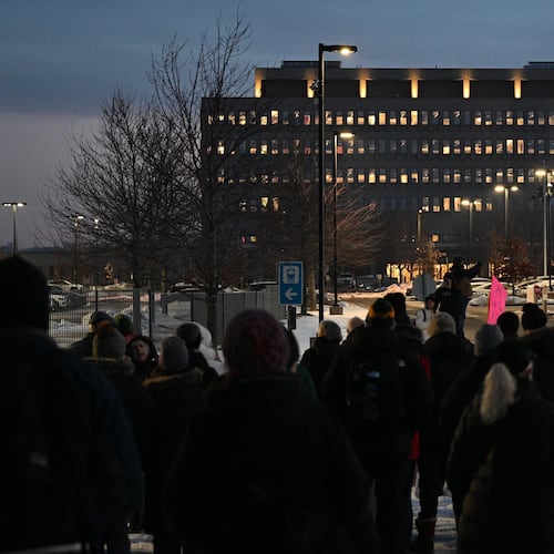 FILE - Protesters gather outside the Bishop Henry Whipple Federal Building, Jan. 8, 2026, in Minneapolis, Minn. (AP Photo/Tom Baker, File)