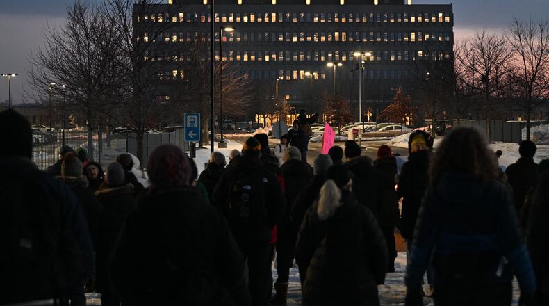 FILE - Protesters gather outside the Bishop Henry Whipple Federal Building, Jan. 8, 2026, in Minneapolis, Minn. (AP Photo/Tom Baker, File)