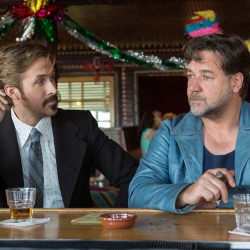 This image released by Warner Bros. shows Ryan Gosling, left, and Russell Crowe in a scene from "The Nice Guys." (Daniel McFadden/Warner Bros. via AP)