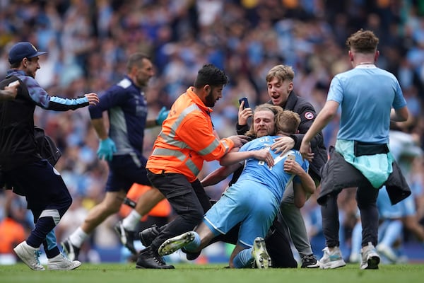 FILE - Manchester City's Kevin De Bruyne celebrates with fans after winning the English Premier League soccer match between Manchester City and Aston Villa at the Etihad Stadium in Manchester, England, Sunday, May 22, 2022.(AP Photo/Dave Thompson, file)