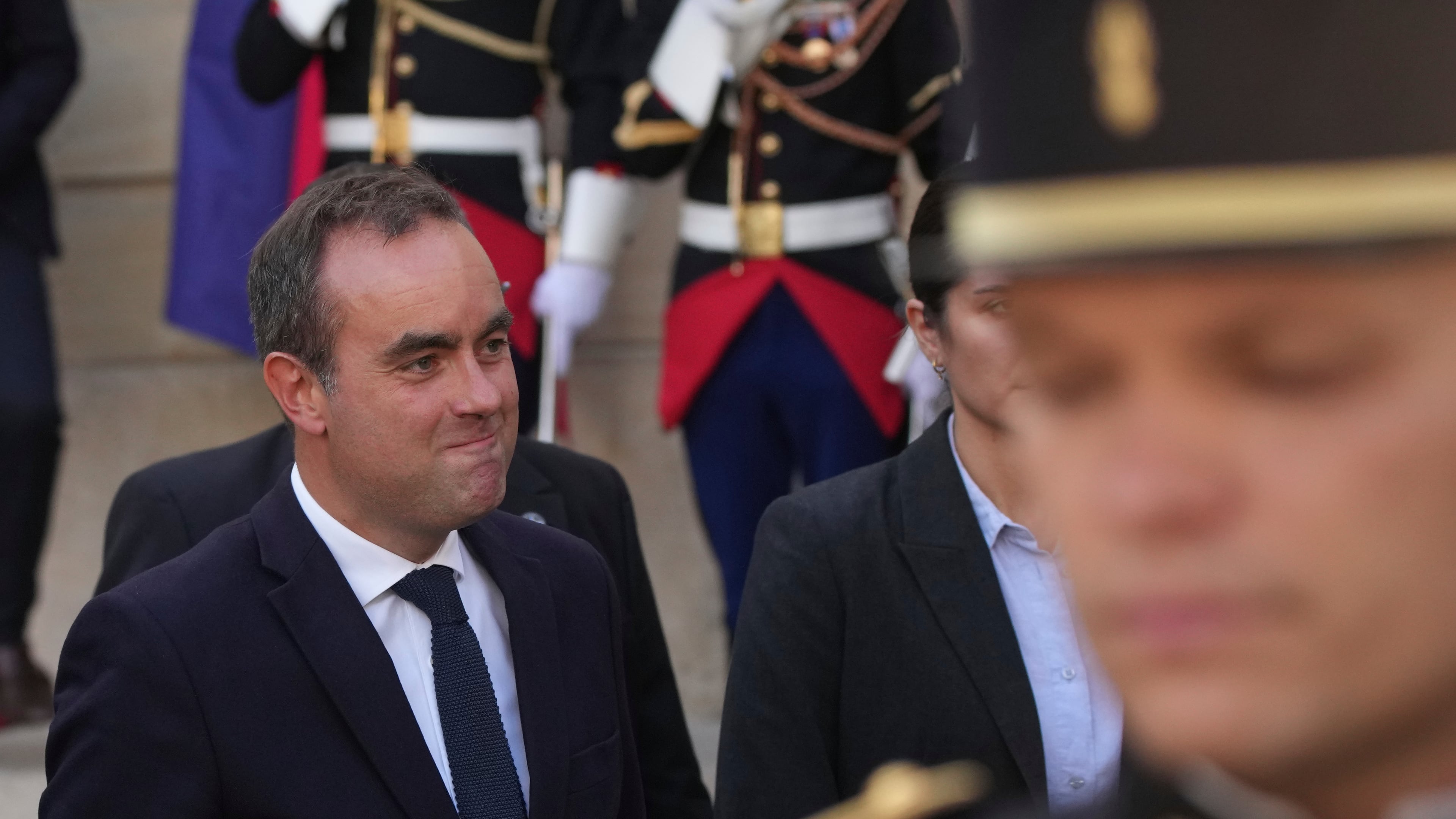 Newly named Prime Minister Sebastien Lecornu, left, smiles after a handover ceremony at the Prime Minister residence, in Paris, France, Wednesday, Sept. 10, 2025. (AP Photo/Christophe Ena)