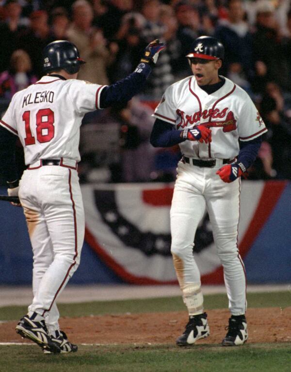 OCTOBER 28, 1995 ATLANTA WORLD SERIES GAME 6 10/28/95: Ryan Klesko congratulates David Justice after Justice's 6th inning homer. (AJC photo/Frank Niemeir)