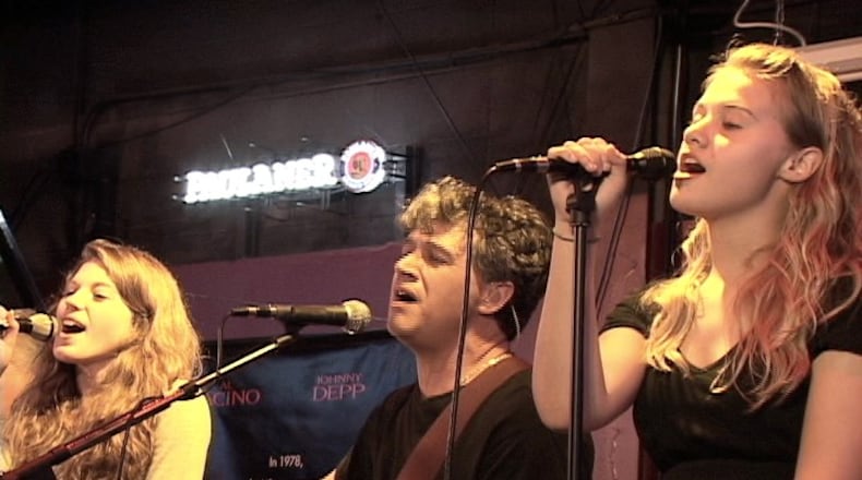 Maggie Adams (left), Tim Purcell and Sammie Purcell perform in the first incarnation of the Smyrna cover band Foxes and Fossils. Courtesy of Terry Heinlein