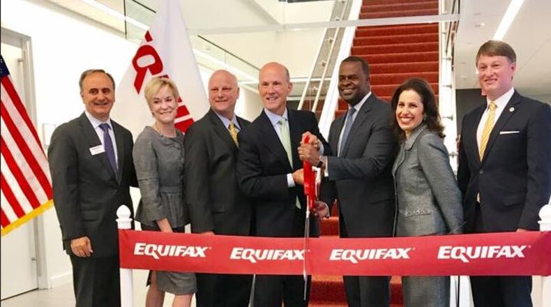 Mayor Kasim Reed cuts the ribbon at the grand opening of Equifax’s newest location which will bring 800 jobs to Midtown. CONTRIBUTED