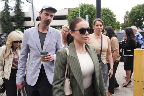 Family members and supporters of Erik and Lyle Menendez arrive in court for a hearing in their case Thursday, April 17, 2025, in Los Angeles. (AP Photo/Damian Dovarganes)