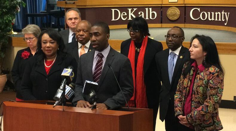 DeKalb County’s CEO and Board of Commissioners would be restructured on legislation introduced in the Georgia General Assembly on Monday. Pictured are Interim DeKalb CEO Lee May surrounded by commissioners.
