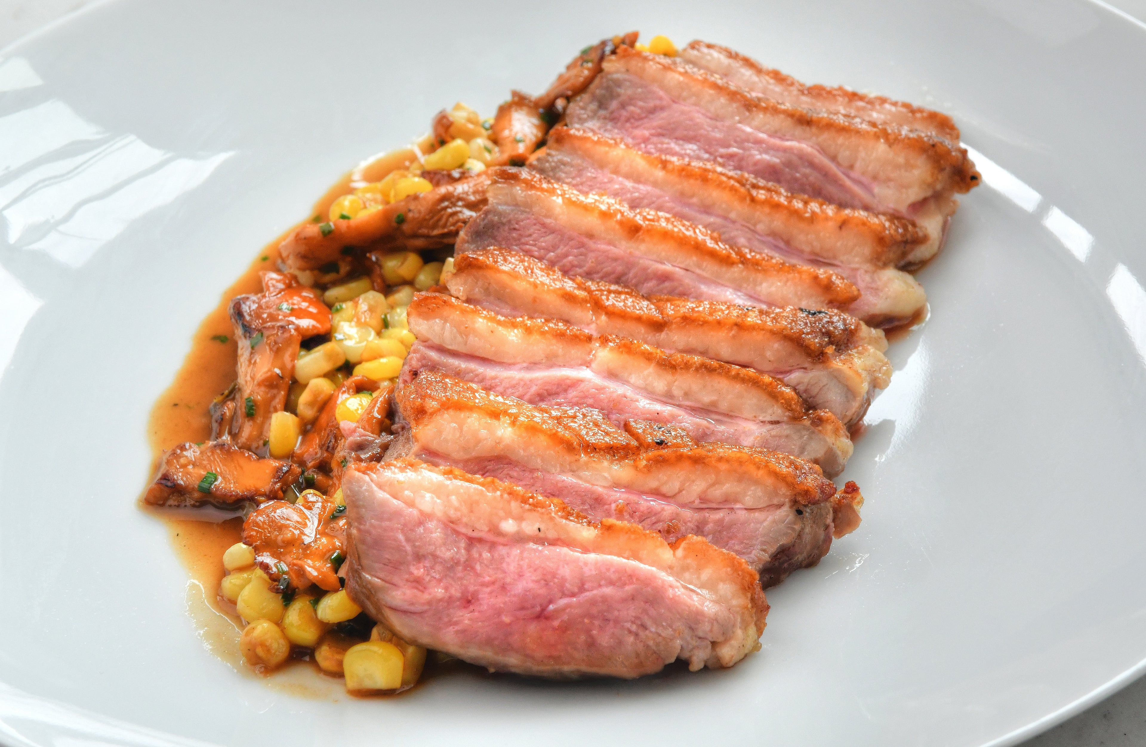 Roast duck is among the larger plates offered at Lucian Books and Wine. (Chris Hunt for the AJC)